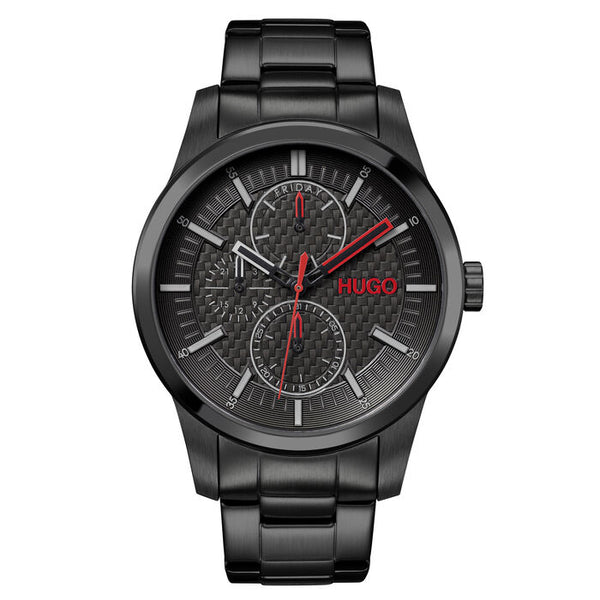 A bold 46mm men's watch with a carbon fiber-look black dial, featuring dual sub-dials and a striking red "HUGO" logo. The black stainless steel case and bracelet offer a sleek, modern look, complemented by red and silver-tone hands for enhanced visibility. The day of the week is displayed at the top, with a sporty, sophisticated style suitable for any occasion.