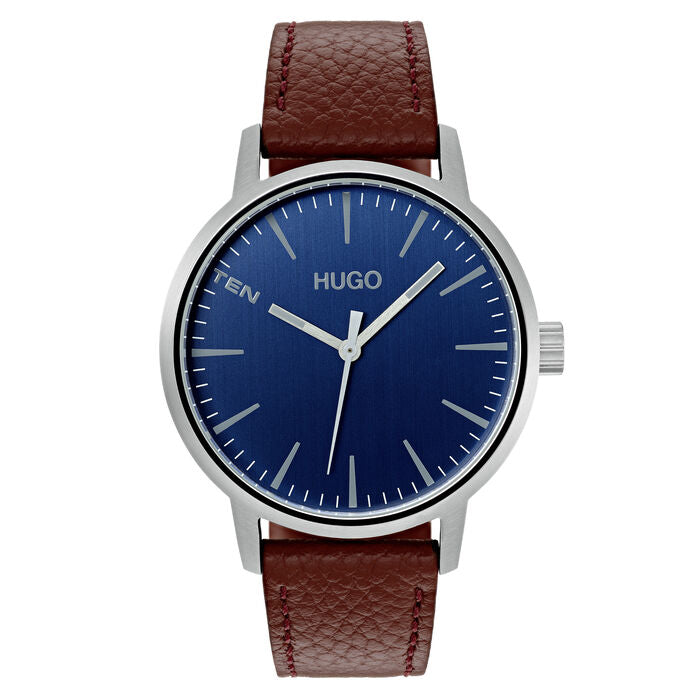 Hugo Boss Stand men's watch, 42mm silver-tone stainless steel case, blue sunray dial with minimalist hour markers and "TEN" text at 10 o'clock, brown textured leather strap, bold and modern design.