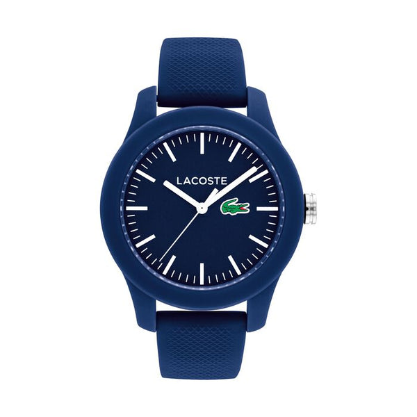 Lacoste 12.12 women's watch, 38mm blue resin case and textured silicone strap, blue dial with white hour markers, Lacoste logo at 3 o'clock with green crocodile emblem, sporty and minimalist design.