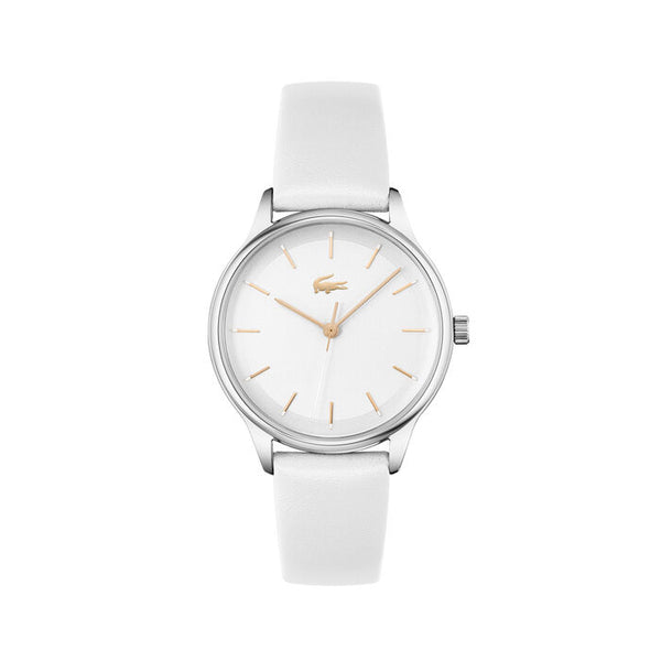Lacoste Club women's watch, 34mm polished silver-tone stainless steel case, white dial with gold-tone hour markers and crocodile logo at 12 o'clock, white leather strap, minimalist analog design.
