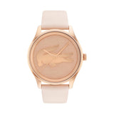 Lacoste Victoria women's watch, 38mm rose gold-tone stainless steel case, brushed rose gold dial with embossed crocodile logo, minimalist design, light pink leather strap.