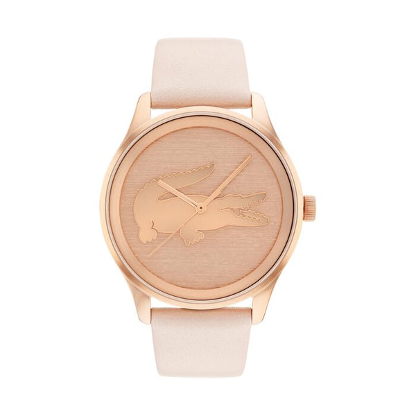 Lacoste Victoria women's watch, 38mm rose gold-tone stainless steel case, brushed rose gold dial with embossed crocodile logo, minimalist design, light pink leather strap.