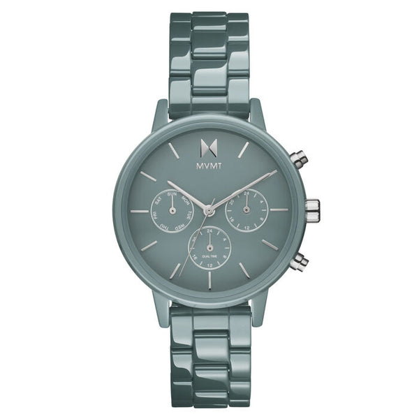 MVMT Women’s New Ceramic Watch, 38mm matte teal ceramic case and bracelet, matching teal dial with three subdials for weekday, date, and dual time, silver-tone hands and markers, modern quartz movement.