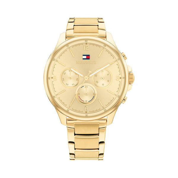 Tommy Hilfiger Golden Aura women’s chronograph watch 38mm with gold-tone stainless steel case and bracelet, featuring a monochromatic gold dial, three functional subdials for day, date, and 24-hour time, minimalist hour markers, and the Tommy Hilfiger flag logo at 12 o’clock.